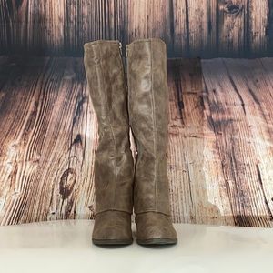 Fergalicious woman’s brown heeled boots